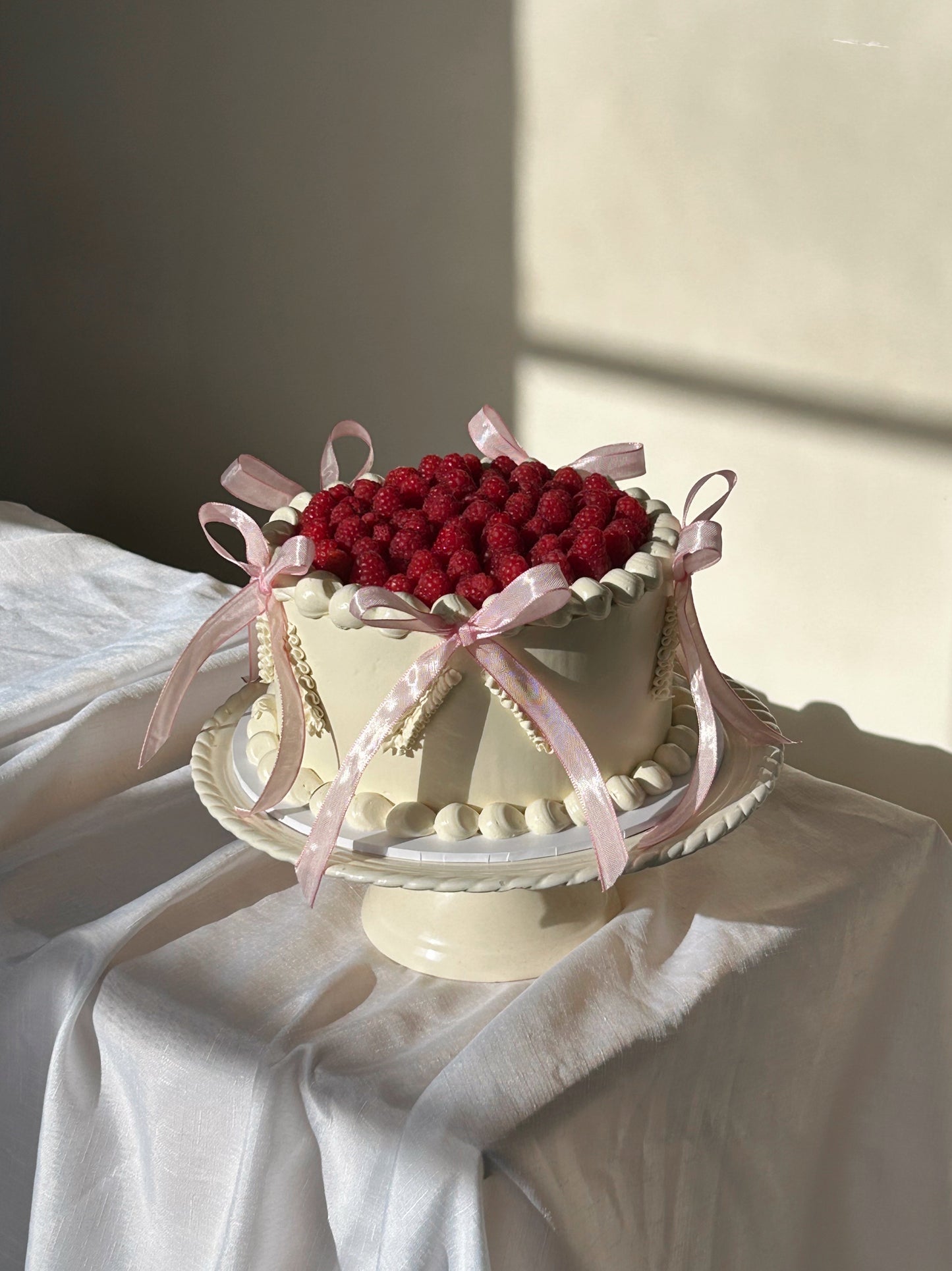 Raspberry Cake with Piping and Bows